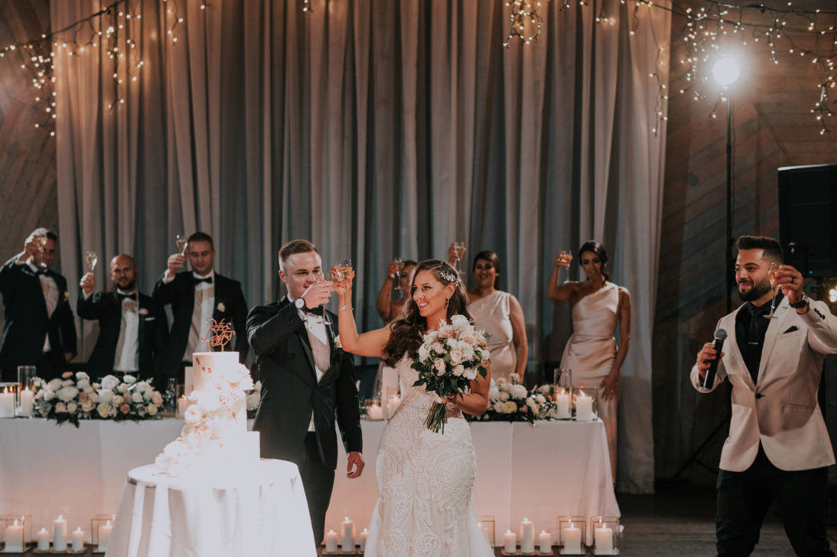 couple toasting after groom's speech at wedding