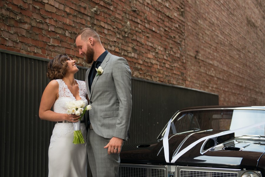 Kristie and Dylan maximised the industrial setting at Luminaire for their photos. See their Real Wedding