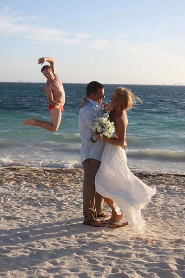 Nothing says romance like a photobomber in red Speedos! 