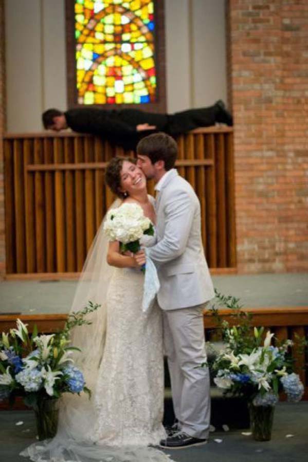 Planking priest wedding photobomb