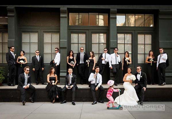 A child zipping past this formal wedding photo adds a little bit of fun - and makes for a great wedding photo