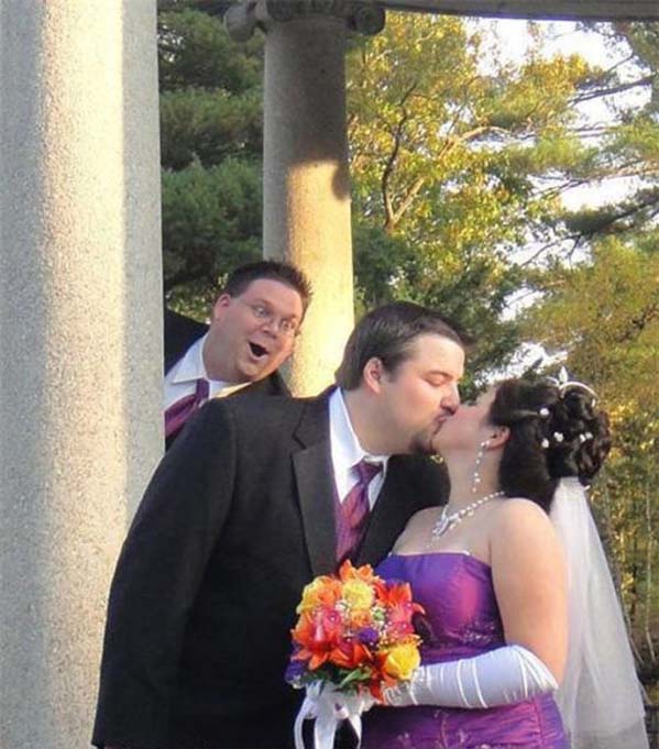 funny groomsman wedding photobomb