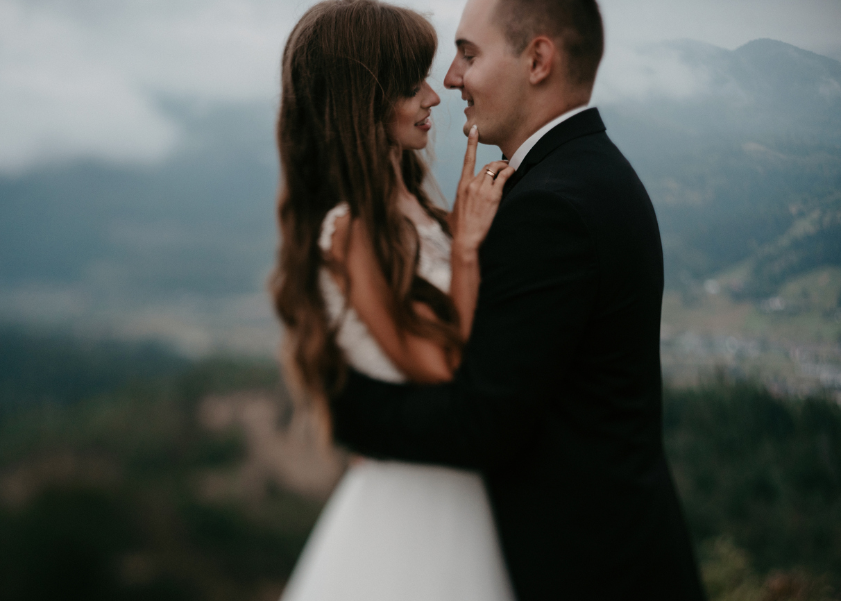 Loving wedding couple at the moment before kissingoutdoor