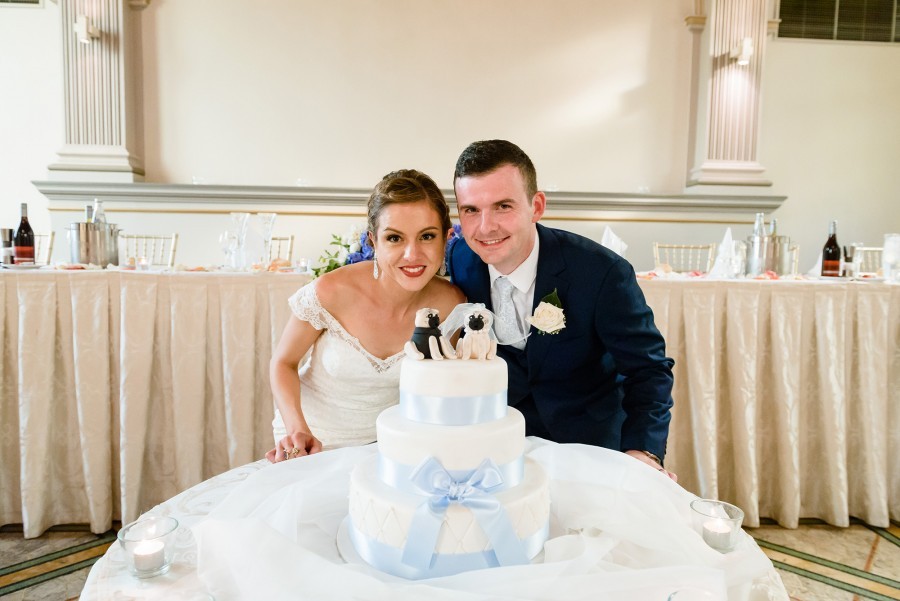 Creative cake topper pugs with newlyweds