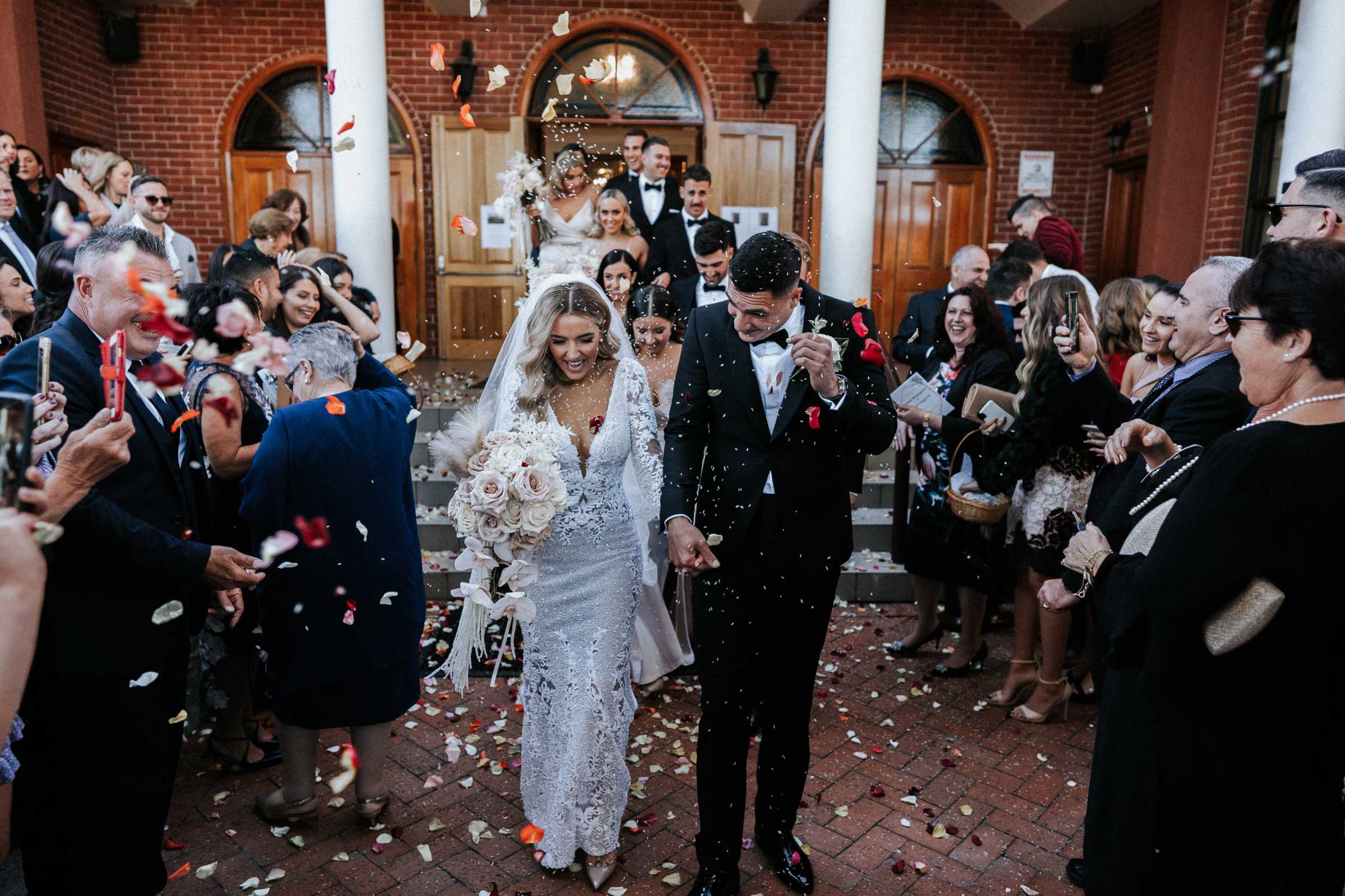 Doltone House Jones Bay Wharf Sydney wedding, Riannon and Mitch, newlyweds leaving the church, photo by The Evoke Company