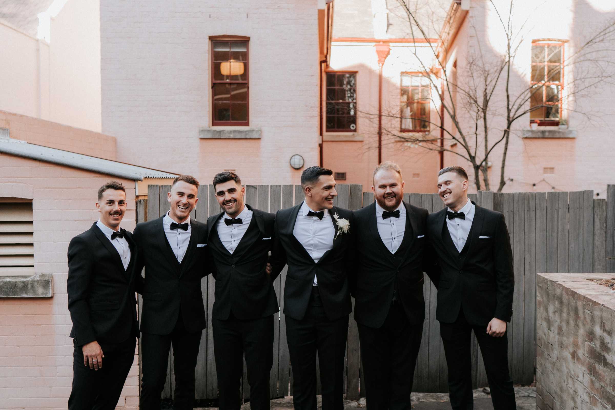 Doltone House Jones Bay Wharf Sydney wedding, Riannon and Mitch, groom and groomsmen in black tuxes, photo by The Evoke Company