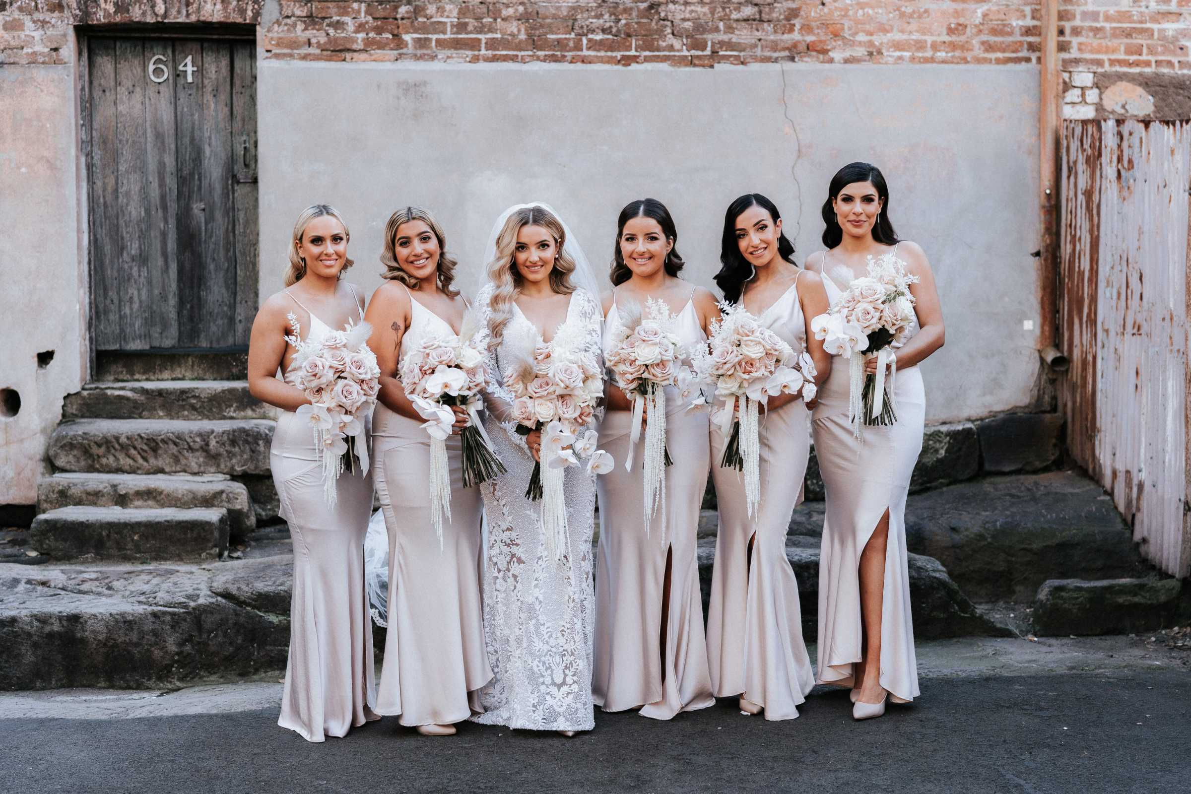 Doltone House Jones Bay Wharf Sydney wedding, Riannon and Mitch, bride and bridesmaids holding bouquets, photo by The Evoke Company