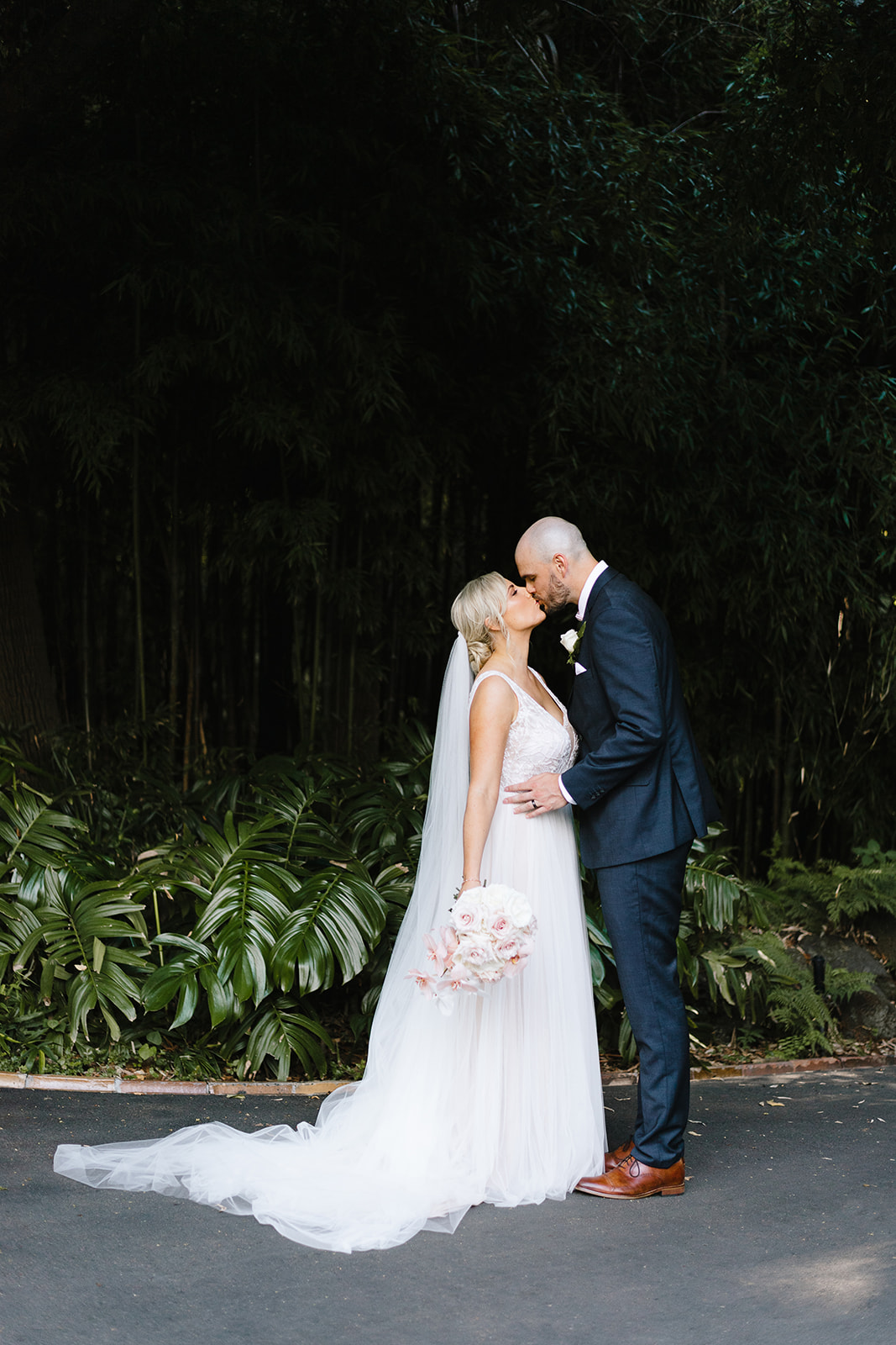 Bride and groom kiss at The Terrace Royal Botanic Gardens Melbourne wedding