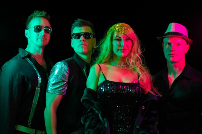 Natalie Parnall (centre) with her band, Escape Music Live